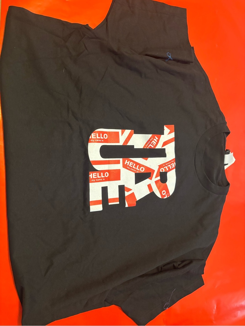 Reason Black Tee with Red & White 'Hello' Graphic